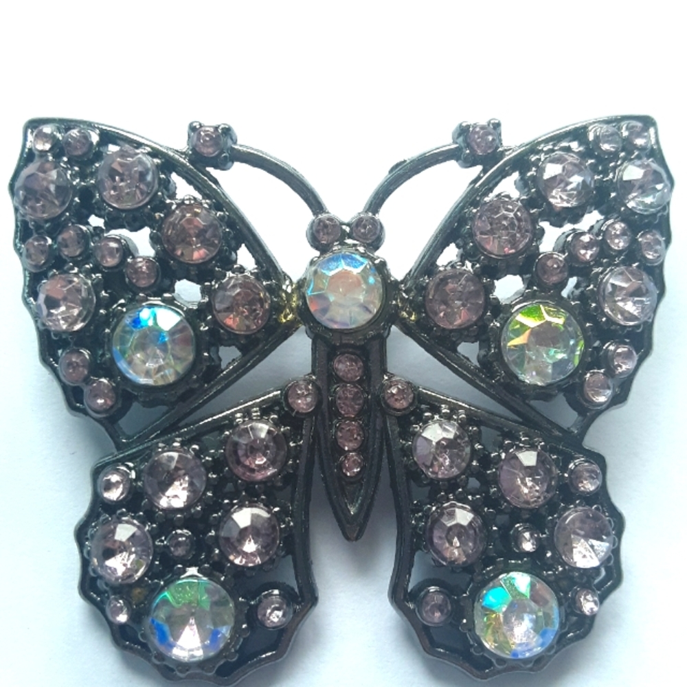 Butterfly rhinestone silver-tone pin.